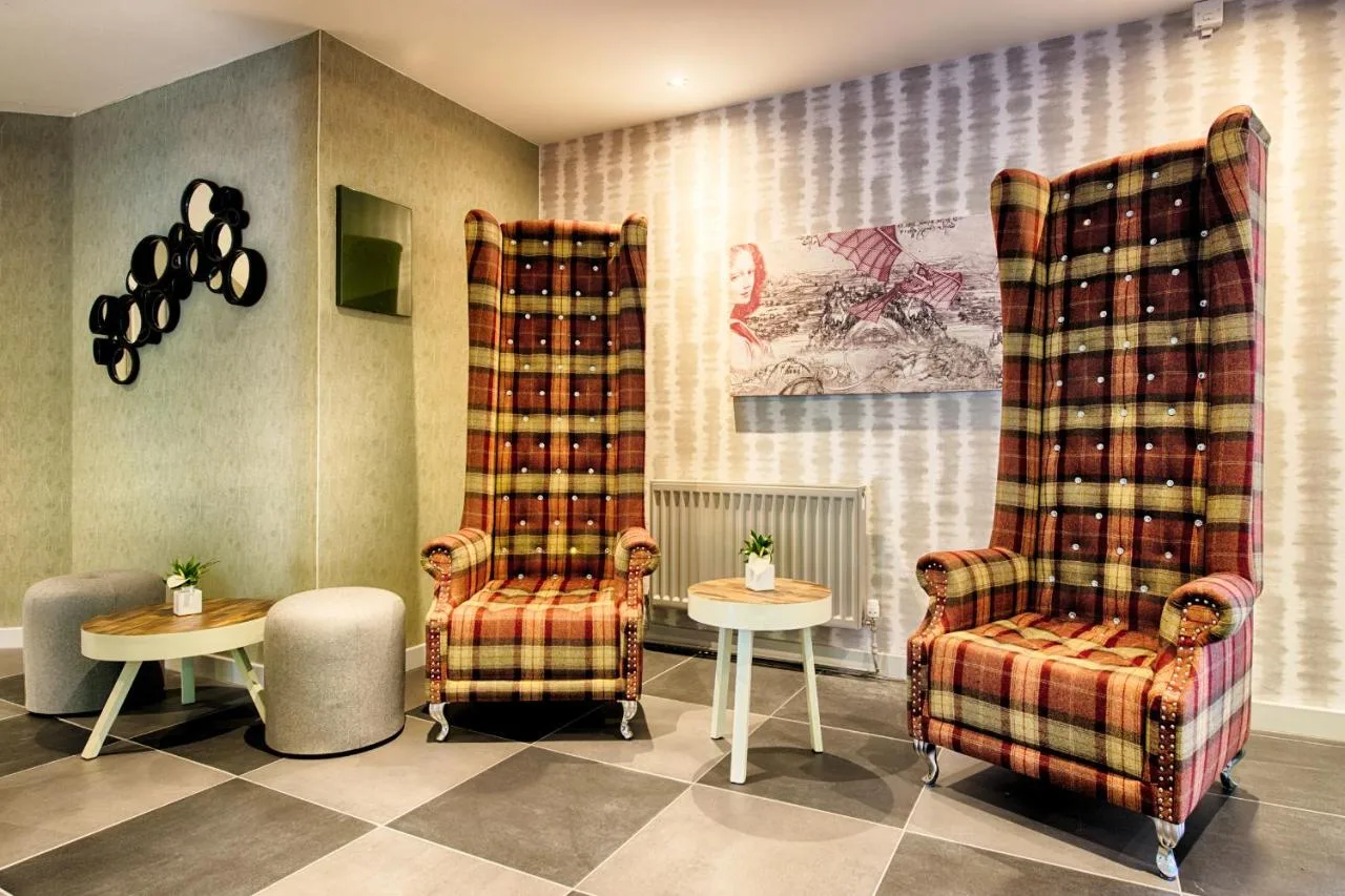 a waiting room with two chairs and a table at Leonardo Hotel Edinburgh Haymarket in Edinburgh